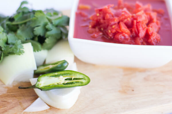 A simple homemade salsa recipe using jalapenos, onion, cilantro, tomatoes, salt, and garlic. Just put these in the food processor and you're done! https://www.intoxicatedonlife.com/2012/05/13/homemade-salsa-recipe/