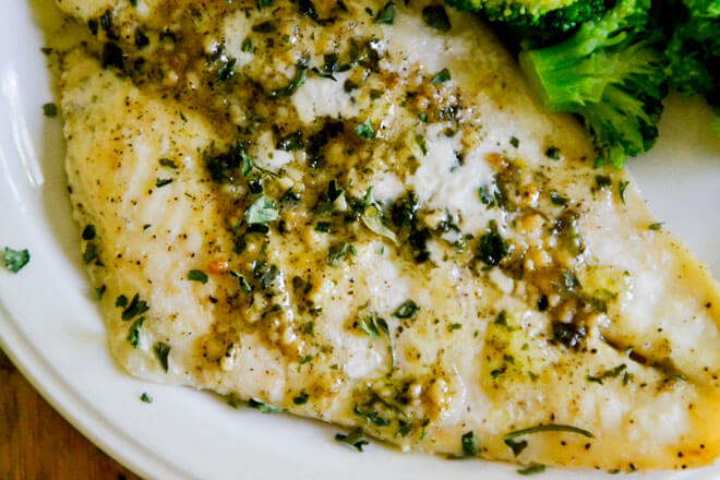 This Easy Baked Fish with Lemon Butter Sauce will have you feeling like a chef from the comfort of your kitchen!