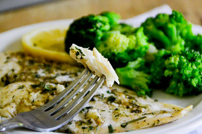 This Easy Baked Fish with Lemon Butter Sauce will have you feeling like a chef from the comfort of your kitchen!